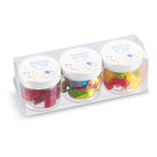 Three small jars of colorful gummy bears in a clear plastic packaging 
