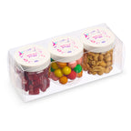 Three small jars with candy and nuts in a clear packaging box.
